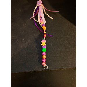 Handmade beaded purse or book bag dangler says iris on it
